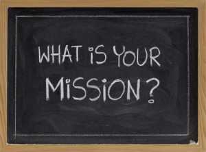 Blackboard with chalk writing "What is Your Mission?"